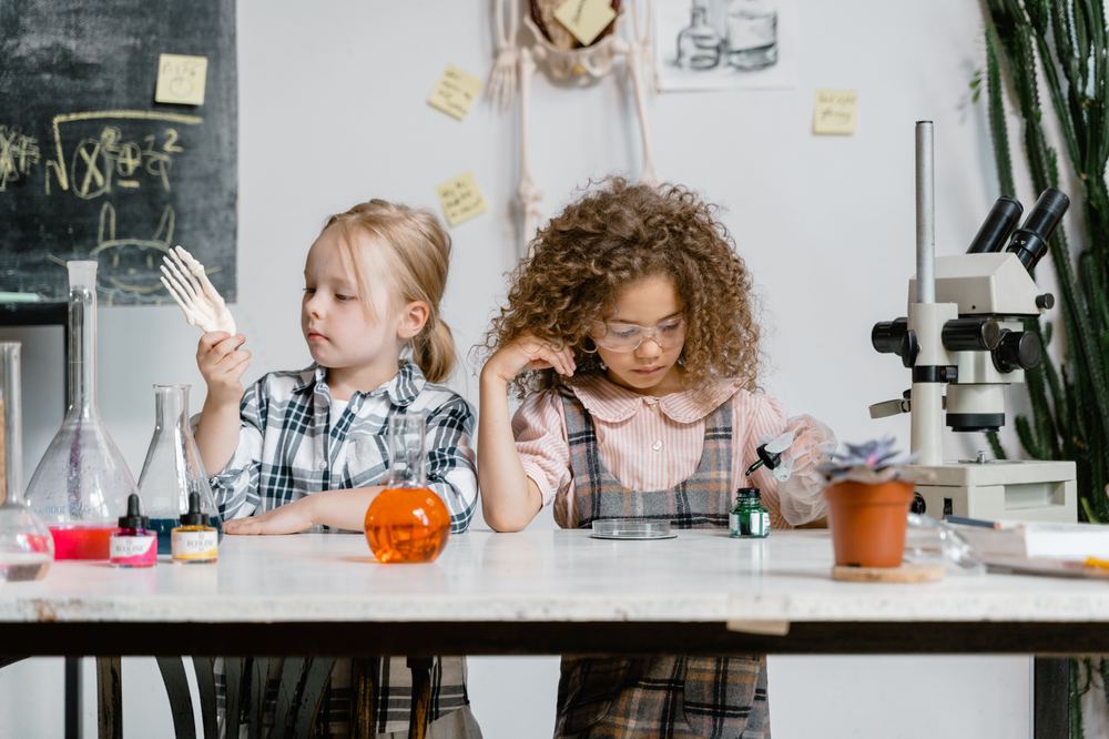Children doing hands-on science experiments at a table
